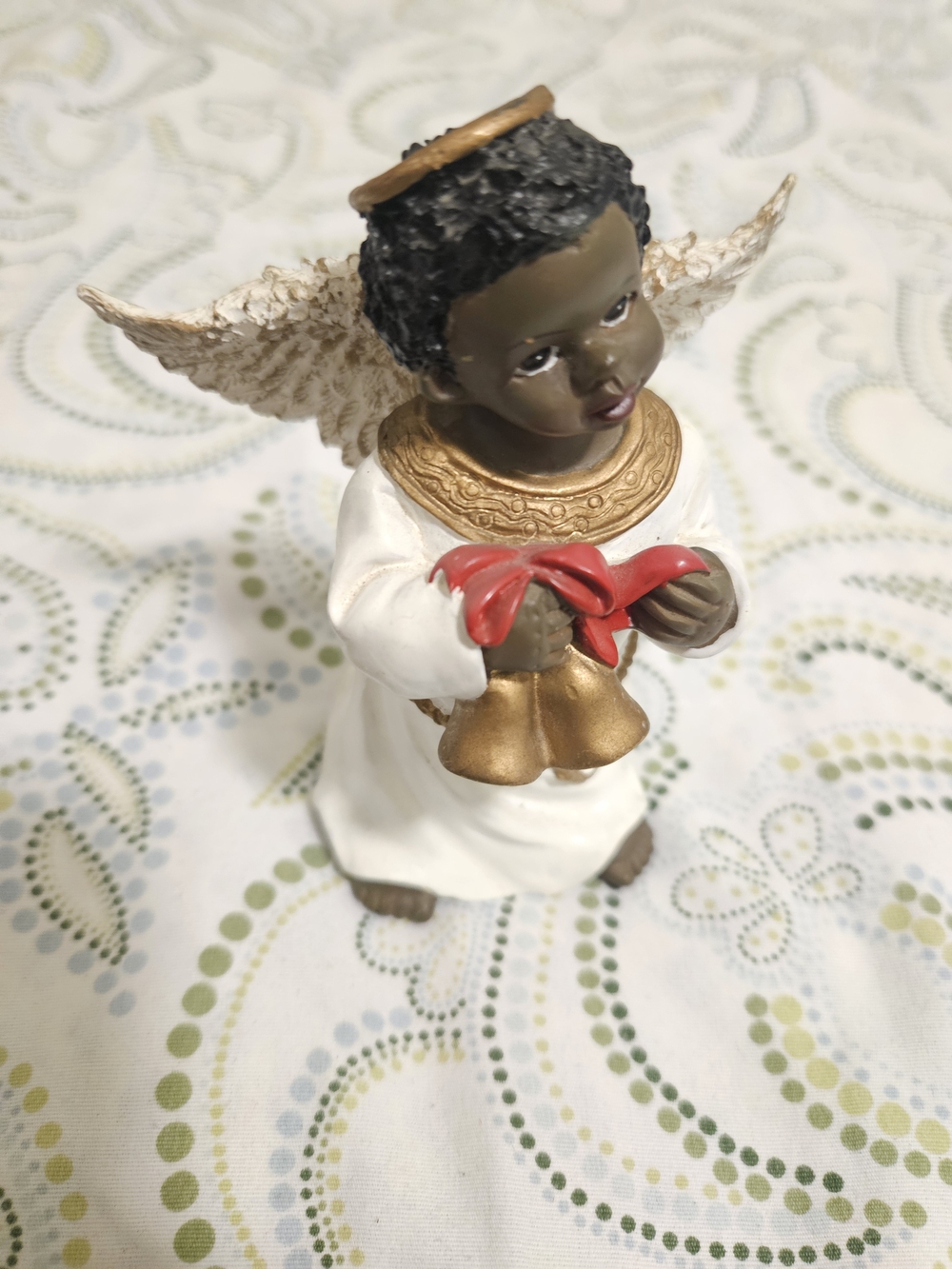 Hand-Painted Black Angel Figurine in White and Gold with Red Bow